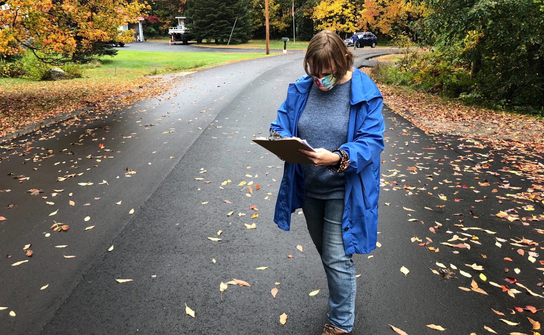 Planned Parenthood volunteer Sarah Mahoney checks a list of addresses in Windham, Maine to see which door to knock on next. 