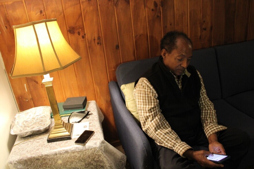 Hagos Tsadik at his house in Cape Elizabeth, Maine. Tsadik says he is constantly checking the news for updates on the war in Ethiopia.