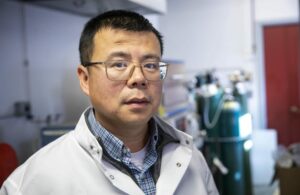 A portrait of Professor of Mechanical Engineering Yan Wang at his laboratory at Worcester Polytechnic Institute.