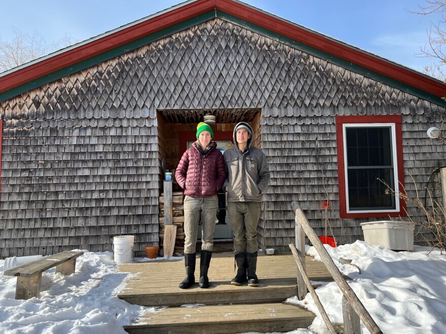 Johanna Davis and Adam Nordell stand outside of their house at Songbird Farm, an organic vegetable and grain farm they have operated since 2014 in Unity, Maine.