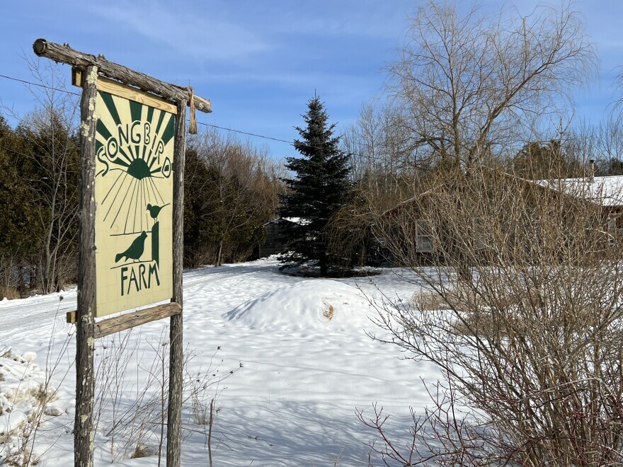 The sign outside Songbird Farm, an organic farm in Unity, Maine, that is the latest agricultural operation in Maine to be impacted by contamination with “forever chemicals” known as PFAS, potentially linked to sludge used as fertilizer decades ago.