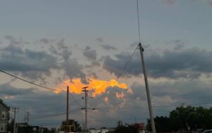 The sky glows over Burlington, VT, near the end of August.