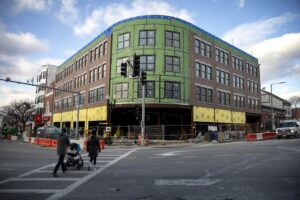 480 West Broadway describes itself as an "18 unit condo project" under construction on the corner where East and West Broadway meet.