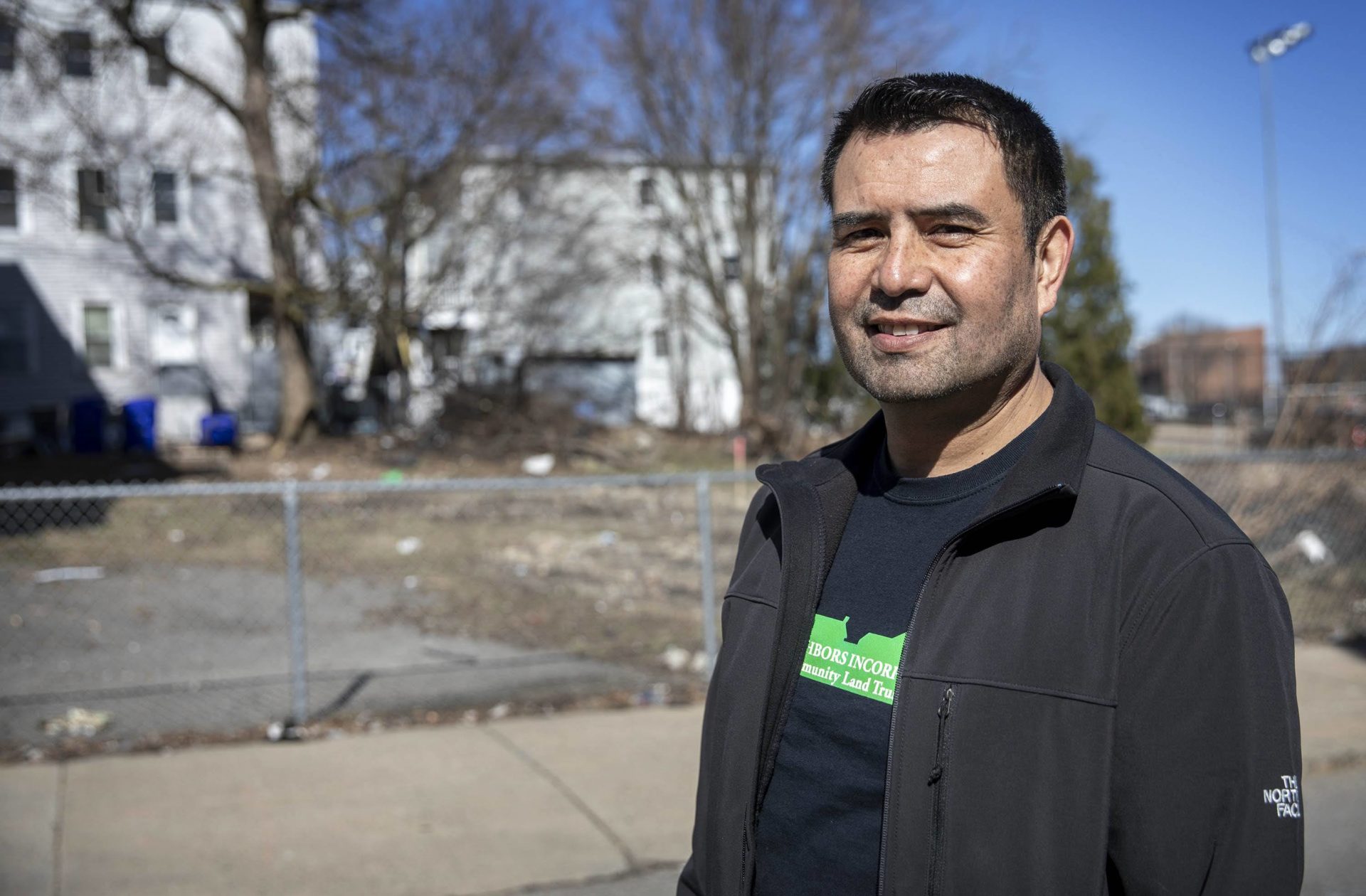 René Mardones, DSNI’s director of community organizing, at a site for four new housing units on Magnolia Street.