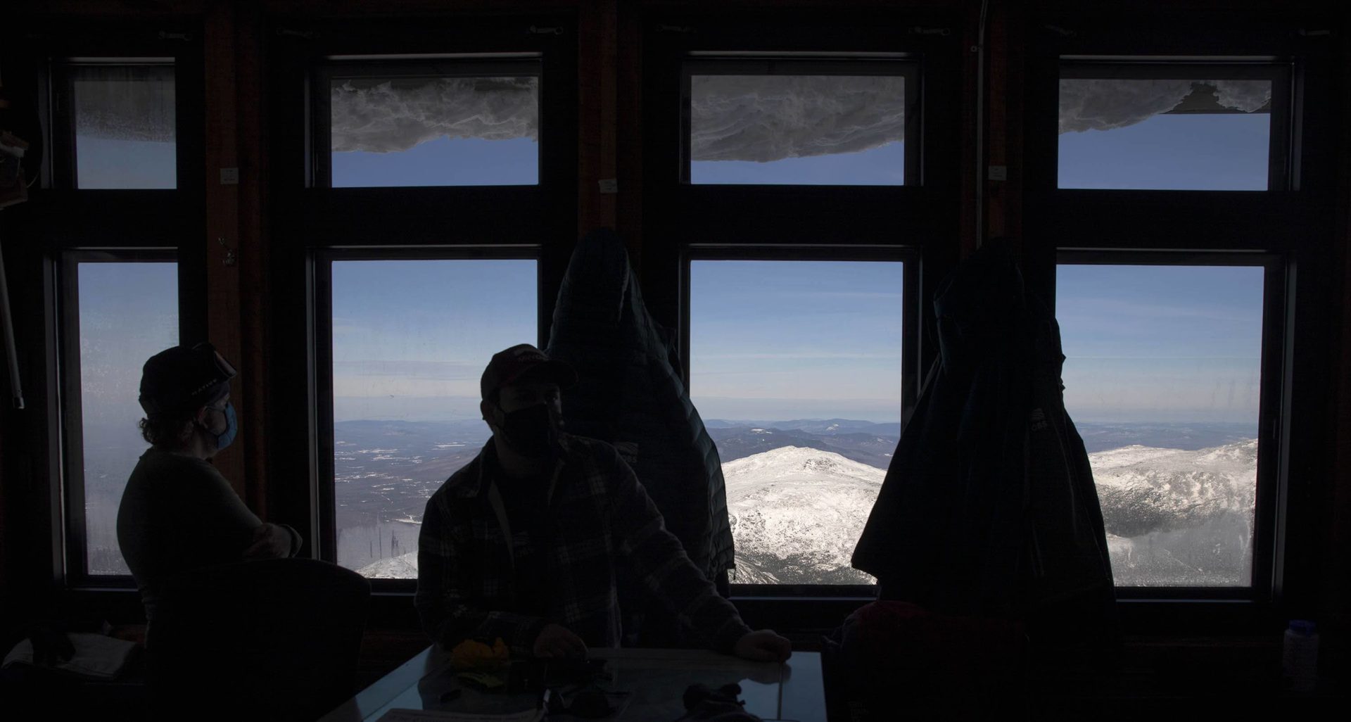 Looking out of the windows of the Mount Washington Observatory. 