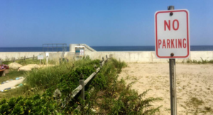 A "no parking" sign guards the entrance to the town-owned Sunrise Beach in Marshfield, Mass.