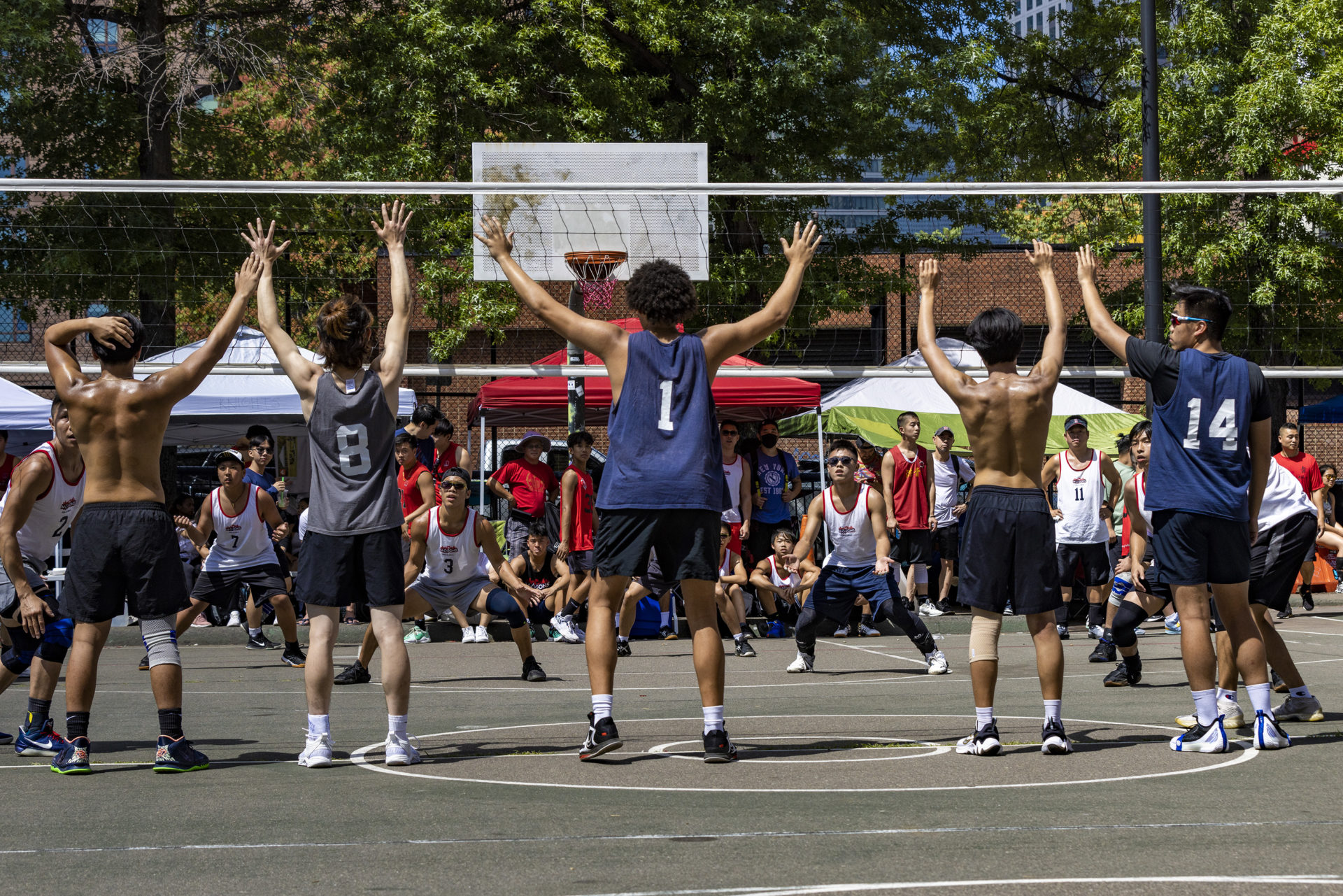 The Free Masons face off against the Rising Tide during the Reggie Wong Memorial Volleyball Tournament at Reggie Wong Park in Boston Chinatown.