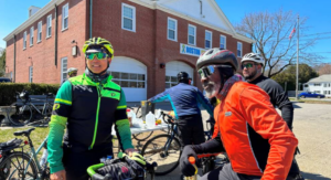 Cyclists Peter Cheung (left) and Daniel Day (right), both wearing bright cycling clothing, take part in a daytime training ride in advance of Sunday night's midnight marathon ride.