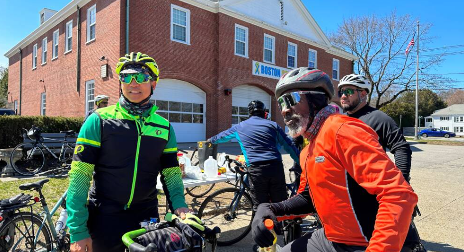 Cyclists Peter Cheung (left) and Daniel Day (right), both wearing bright cycling clothing, take part in a daytime training ride in advance of Sunday night's midnight marathon ride. 