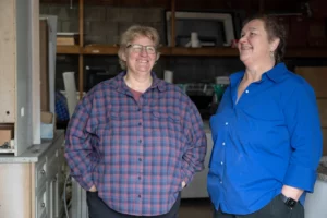 WasteNot co-owners Ann Jarosiewicz and Liz Prete stand for a photo at the company's warehouse in Falmouth, Mass.