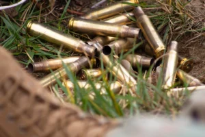 Brass shell casings for the .50 caliber machine gun, informally known as “Ma Deuce.” Many Massachusetts soldiers must travel to Vermont to qualify with the weapon.