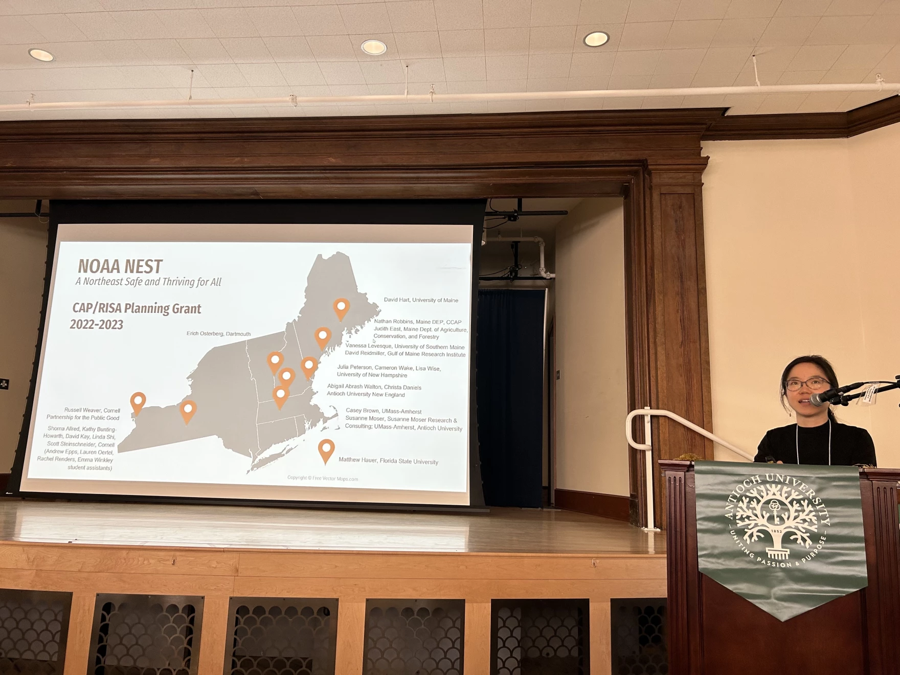 Cornell professor Linda Shi talks to an audience in Keene about climate migration, May 17, 2023.