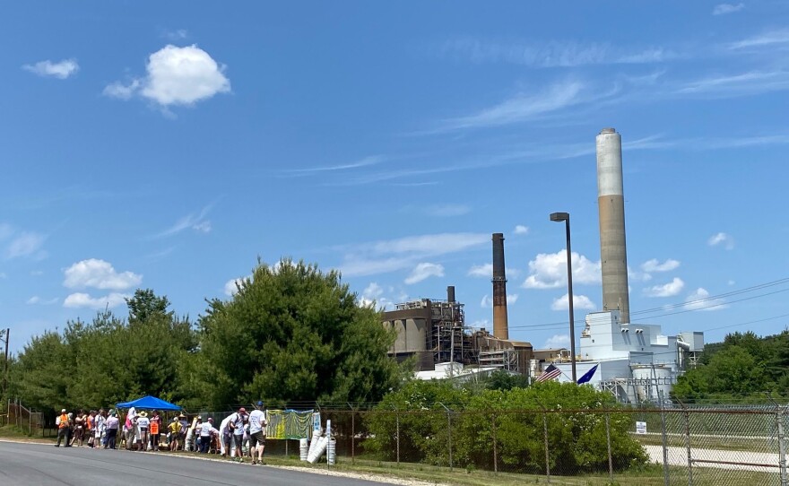 Advocates gathered outside of the Merrimack Station in Bow, NH to call for the coal plant's retirement