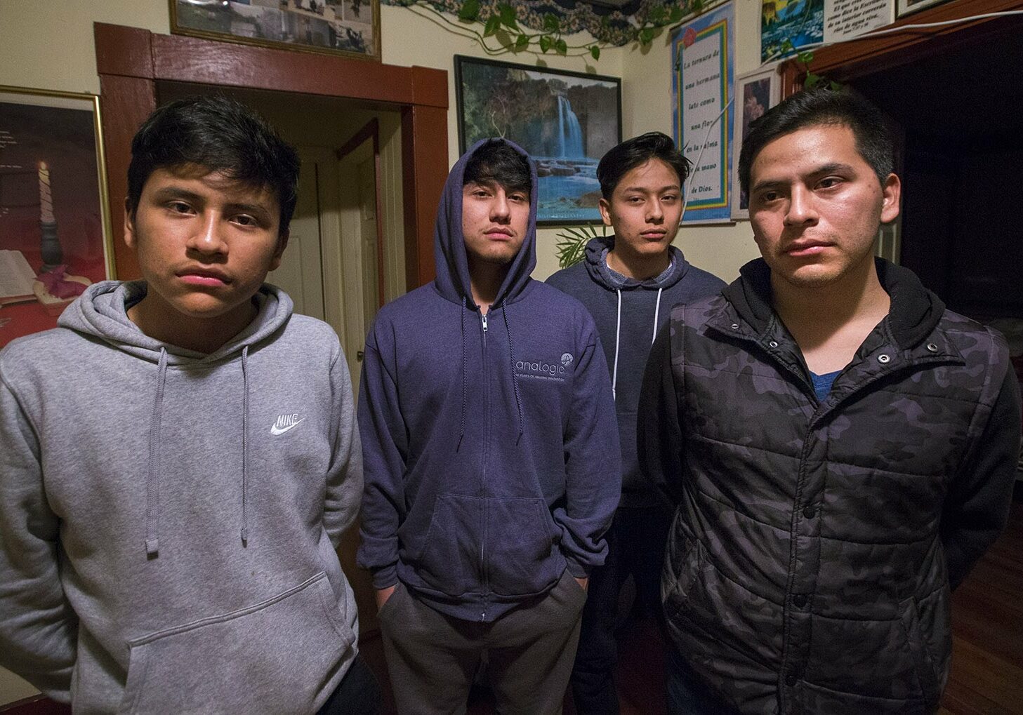 Isidro Macario, 27 right, wes brought here as a young child from Guatamala is facing deportation potentially making him leave behind the rest of his family, (l-r) Saul, 16, Anthony, 18 and Erwin, 21, who were born in the United States. (Jesse Costa/WBUR)