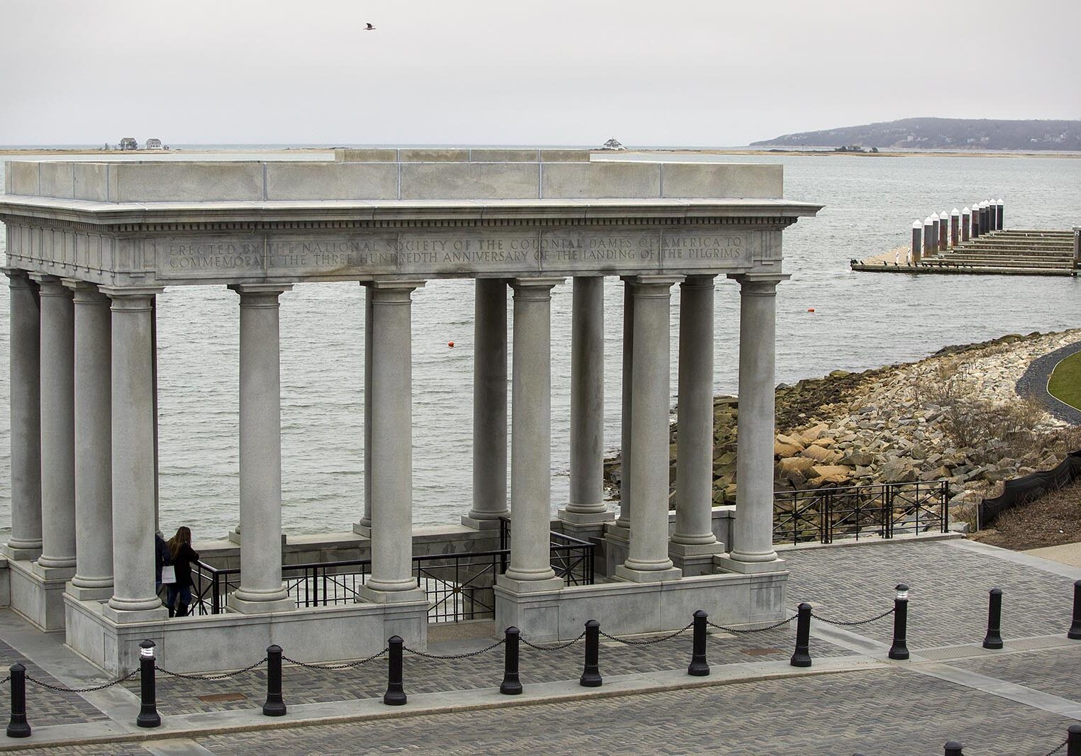 The Plymouth Rock portico looks out across the Plymouth Bay to Rocky Point, the location of Pilgrim Nuclear Power Station. Photo by Robin Lubbock for WBUR