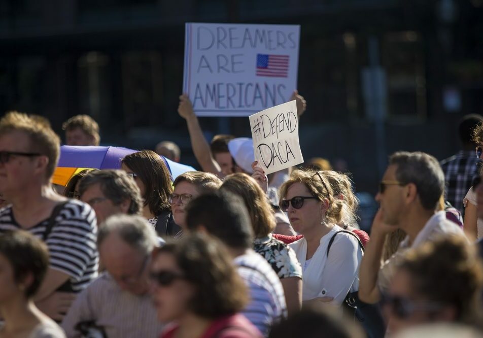 People gathered at Faneuil Hall in Boston Tuesday to protest the Trump administration's decision to end the Deferred Action for Childhood Arrivals program, which granted temporary status to some people whose parents brought them into the country illegally as children. Photo by Jesse Costa for WBUR
