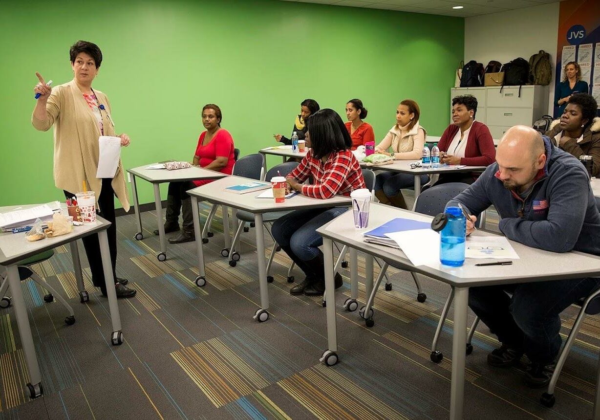 Instructor Elizabeth Hogan leads a healthcare class at Jewish Vocational Service in Boston. (Credit: Robin Lubbock/WBUR)
