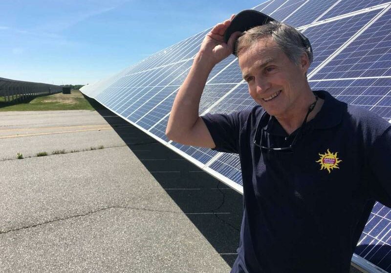 Steve Hinchman of ReVision Energy at the 1.5 megawatt solar plant the company installed at Brunswick Landing. Photo by Fred Bever for Maine Public