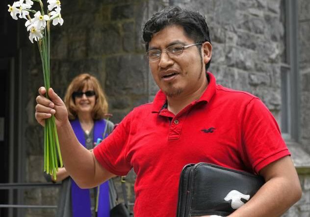 Lucio Perez greets friends after arriving back into the  First Congregational Church of Amherst, after a stay in Cooley Dickinson Hospital for a medical emergency.