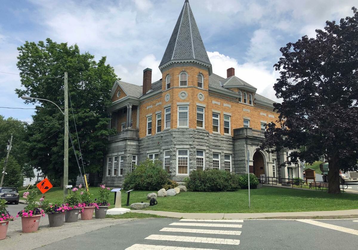 Flower pots and landscaping stones mark the international border between Stanstead, Quebec, and Derby Line, Vt. Inside the Haskell Free Library and Opera House, the border is marked by a line on the floor. Photo by Amy Kolb Noyes for VPR