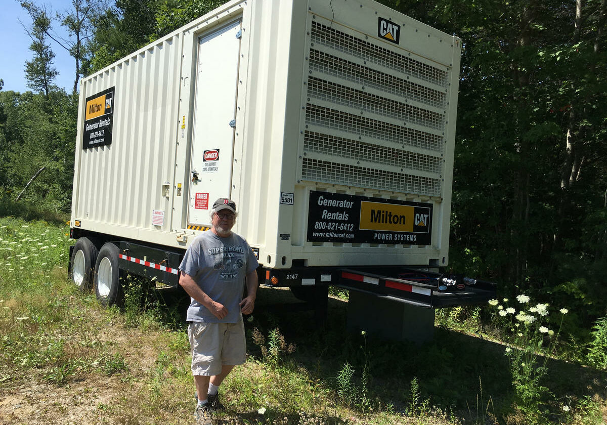 A grid-scale diesel generator near Mike Elkins' furniture-making company can quickly deliver 500 kilowatts of electricity to the Boothbay area.
Credit: Fred Bever, MPBN