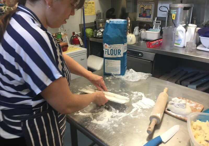 Irida Kakhtiranova, who's living at the Unitarian Church in Northampton, Massachusetts, making pierogies. Photo by Karen Brown for NEPR