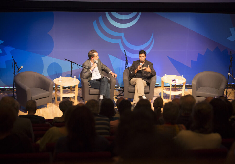 John Dankosky interviews Mushfiq Mobarak at a live Arts and Ideas Panel. Photo by Judy Rosenthal