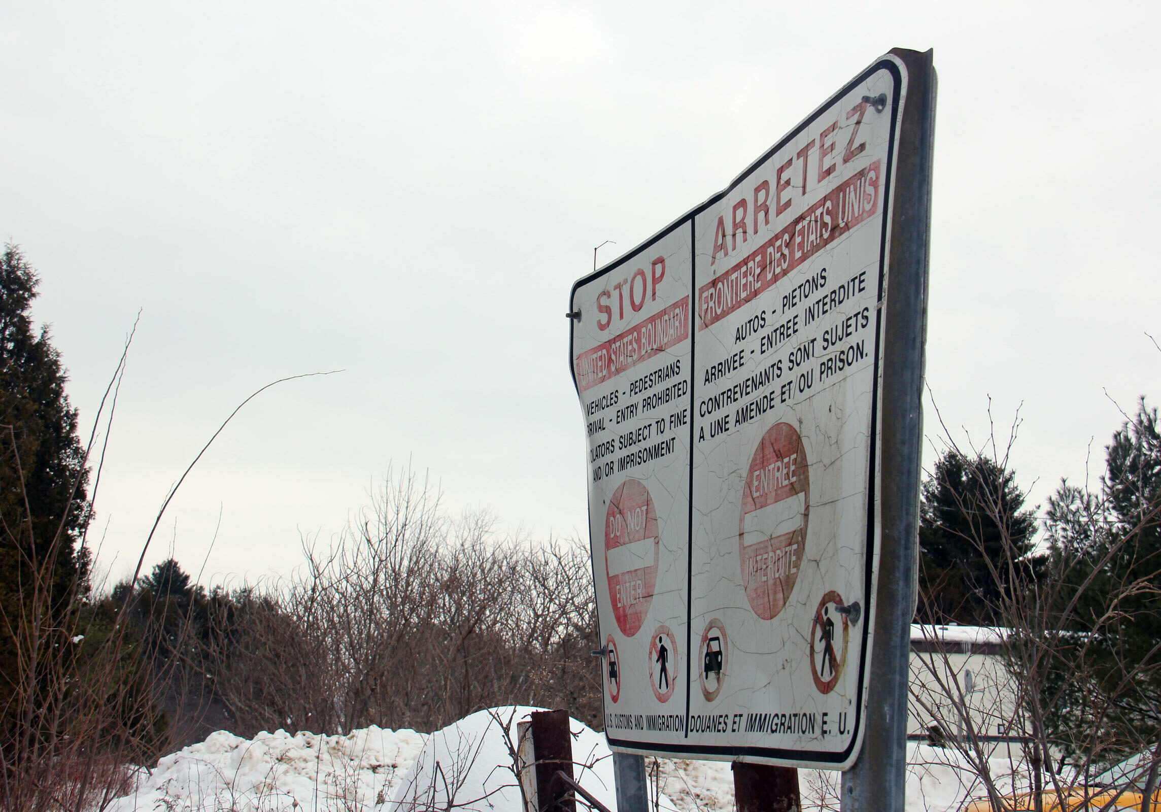 This sign marks the Canadian side of the border at one rural area where many people are crossing illegally into Canada. Mamadou was in the woods somewhere within 20 miles of here.
Photo by Kathleen Masterson for NENC