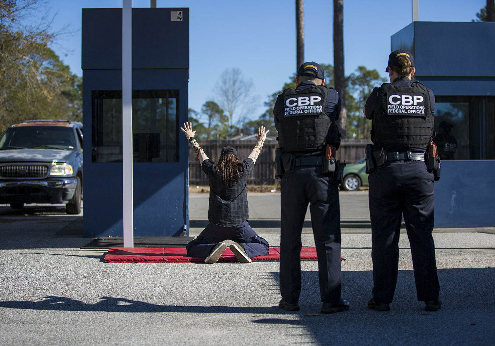 At the federal law enforcement training center in Brunswick, Georgia, U.S. Customs and Border Protection officer trainees conduct a border crossing drill. Photo by Jesse Costa for WBUR