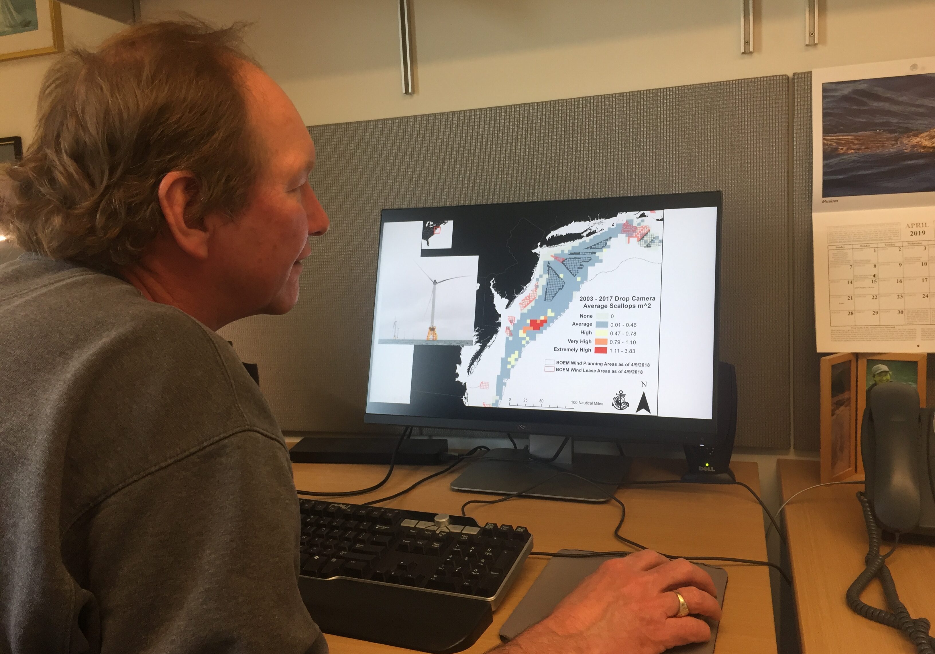 Dr. Kevin Stokesbury shows a map of scallop surveys and proposed offshore wind farms in the Mid-Atlantic. Photo by Nadine Sebai for The Public's Radio