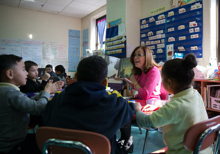 Nilda Medina, a first-grade bilingual teacher at Sanchez Elementary School in Hartford, teaches students about the seasons. About half of the students in the class are evacuees from Puerto Rico. Photo by Ryan Caron King for Connecticut Public Radio